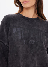 THE UPSIDE women's washed black Cosmic Paloma Crew is an oversized fit with a drop shoulder crafted from heavy organic cotton brushed fleece. Made for everyday.