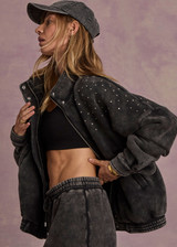 THE UPSIDE women's washed black Cosmic Carmen Moto Jacket is designed for a relaxed fit and features silver meta snap buttons, welt pockets and a soft elasticated hem. Perfect everyday outerwear piece.