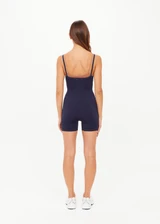 THE UPSIDE women's navy Form Seamless Jamie Bodysuit is firm and suportive and features a scooped neckline with a double layer bra with contrast tan underlayer. Made for pilates and yoga.