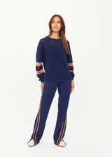 THE UPSIDE women's navy organic cotton Fenway Sebastian Crew offers a relaxed fit and features The Upside logo knit detail on back in tan. Made for lifestyle.