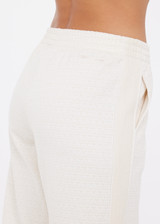 THE UPSIDE women's cream Navar Marnie Wide Leg Pant is a high-rise wide leg fit in our castilla "TU" design and features an elasticated waistband and side seam pockets. Made for everyday wear.