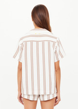 THE UPSIDE women's mocha stripe organic cotton Baja Katia Collared Shirt offers a relaxed fit and features a collar, patch pockets and wooden coconut buttons. Made for lifestyle.