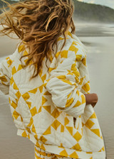 THE UPSIDE women's yellow organic cotton Etoile Carmen Quilted Jacket fits oversized and features front pockets, an elasticated hem and zip through opening. Made for lifestyle.