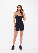 THE UPSIDE women's black recycled rib Rhythm 5inch Spin Short is mid-rise and features cream and mocha binds along side seams. Made for yoga & pilates.