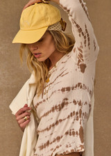THE UPSIDE women's organic cotton rib Ayla Chrissy Long Sleeve Top is designed for a slim fit and features a brown hand tie dye design on a cream base. Made for lifestyle.
