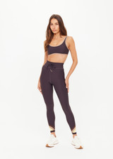 THE UPSIDE women's grey recycled soft peached Kefi 25inch Legging is designed for a mid-rise fit, with an elastic drawcord and aglet ends, crafted with a panelled rainbow feature at the hem. Made for yoga & pilates.