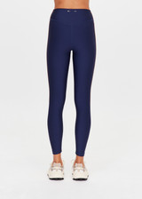 THE UPSIDE women's navy eco tech Toscan 25inch High Legging features a high-rise, breathable design with contrast mocha and cream binds along side seam. Made for yoga & pilates.