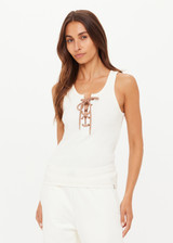 THE UPSIDE women's cream cotton Arkana Rowan Rib Tank has a ribbed fabrication designed for a regular fit and features a lace up front with gold eyelets and braided drawcord. Made for lifestyle.