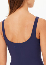 THE UPSIDE women's navy recycled soft peached Amelia Tank Top is designed with a scoop front and back neckline, and features a shelf bra with removable cups. Made for yoga & pilates.
