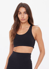 THE UPSIDE women's black recycled jacquard Castilla Jade Bra is a full coverage bra with scooped racerback and features removable cups. Made for yoga & pilates.