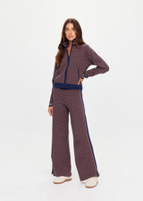 THE UPSIDE women's brown organic cotton Lumiere Margot Knit Jacket is a knitted long sleeve with a geometric star pattern, front pockets and contrast stripes around the sleeves. Made for lifestyle.