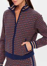 THE UPSIDE women's brown organic cotton Lumiere Margot Knit Jacket is a knitted long sleeve with a geometric star pattern, front pockets and contrast stripes around the sleeves. Made for lifestyle.