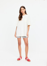 THE UPSIDE women's cream organic cotton Big Beach Tee is an oversized crew neck tee with a ribbed neckline and "dust yourself down" horseshoe artwork printed at back. Made for lifestyle.