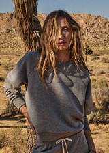 THE UPSIDE women's grey cotton Hit The Road Track Top is a relaxed raglan crew neck sweater in french terry fabrication with a ribbed neckline, arms and cuffs. Made for lifestyle.