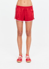 THE UPSIDE women's red 100% silk Run For Your Life Silk Short is a low-rise fit with a soft elastic waistband and cream piping along side seams. Made for lifestyle.