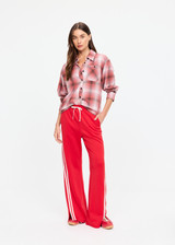 THE UPSIDE women's red When In Roma Holiday Pant is high waisted with an elasticated waistband, made from double faced single jersey fabrication with cream mesh tape along side seams. Made for lifestyle.