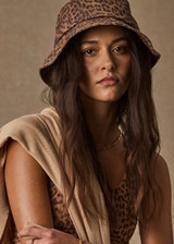 THE UPSIDE women’s leopard 100% cotton Javan Bucket Hat is lightweight with an adjustable inner brim with ribbon and a logo pip at edge. Made for lifestyle.
