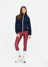 THE UPSIDE women’s navy recyled Sol Fleece Jacket offers a relaxed fit and features a zip through front, front zip pockets, elasticated waist and cuffs and contrast paracord zip pullers. Made for lifestyle.