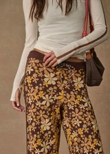 THE UPSIDE women's floral organic cotton Copacabana Juniper Knit Pant offers a soft and supportive fit with a straight leg silhouette, side stripes and drawcord waistband. Made for lifestyle.