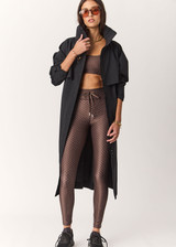 THE UPSIDE women's geo recycled supersoft Poet 25inch Midi Legging features a soft and supportive fit, mid rise waist, adjustable drawcord and signature geo print. Made for yoga and pilates.