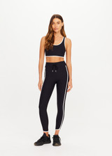 THE UPSIDE women's black Sol Jade Racerback Sports Bra is designed for a soft and supportive fit and features a scooped racerback, contrast binding and removable cups. Made for yoga and pilates.