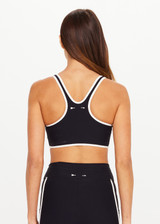 THE UPSIDE women's black Sol Jade Racerback Sports Bra is designed for a soft and supportive fit and features a scooped racerback, contrast binding and removable cups. Made for yoga and pilates.