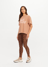THE UPSIDE women’s brown 100% organic cotton Jacob Tee is designed for an oversized fit and features a ribbed collar and printed logo detail. Made for lifestyle.