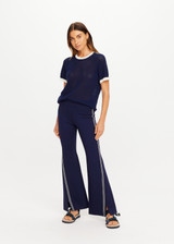 THE UPSIDE women’s navy sustainable Joyela Panelled Flare Pant is mid rise and features an internal elasticated waistband, front and back darts and contrast side stripe tape. Made for lifestyle.