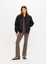THE UPSIDE women's black Tribute Bomber Jacket is a true to size fit and features a classic bomber silhouette, ribbed trims, ruched sleeves and multiple functional pockets. Made for lifestyle.