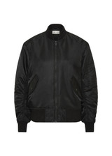 THE UPSIDE women's black Tribute Bomber Jacket is a true to size fit and features a classic bomber silhouette, ribbed trims, ruched sleeves and multiple functional pockets. Made for lifestyle.