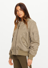 THE UPSIDE women's olive Tribute Bomber Jacket is a true to size style featuring a water resistant finish, paisley lining, ruched sleeve detailing and multiple utility pockets. Made for lifestyle.
