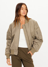 THE UPSIDE women's olive Tribute Bomber Jacket is a true to size style featuring a water resistant finish, paisley lining, ruched sleeve detailing and multiple utility pockets. Made for lifestyle.