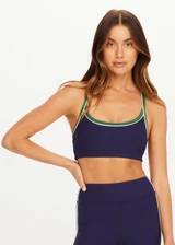 THE UPSIDE women's navy Rhythm Faye Racerback Bra is designed for a supportive and comfortable fit and features a scooped neckline, T-bar back and built in shelf bra with removable cups. Made for pilates.
