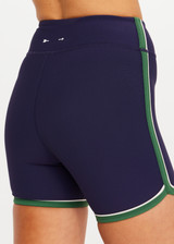 THE UPSIDE women's navy Rhythm 4inch Spin Short is a supportive and comfortable fit and features a mid rise waist, no front seam and contrast side binding. Made for yoga and pilates.