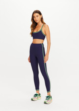 THE UPSIDE women's navy Rhythm 25inch Legging is a supportive and comfortable fit and features a mid rise waist, contrast side binding and streamlined rib fabrication. Made for yoga and pilates.