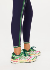 THE UPSIDE women's navy Rhythm 25inch Legging is a supportive and comfortable fit and features a mid rise waist, contrast side binding and streamlined rib fabrication. Made for yoga and pilates.