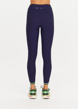 THE UPSIDE women's navy Rhythm 25inch Legging is a supportive and comfortable fit and features a mid rise waist, contrast side binding and streamlined rib fabrication. Made for yoga and pilates.