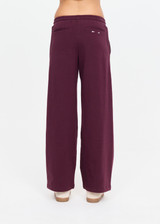 THE UPSIDE women's plum organic cotton Pele Estelle Pant is designed for a relaxed fit and features a wide leg barrel silhouette, elasticated waistband and contrast drawcord detailing. Made for lifestyle.