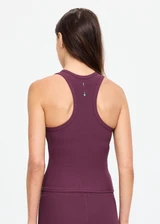 THE UPSIDE women's plum Pele Sophie Tank Top is designed for a supportive and comfortable fit and features a racerback silhouette, built-in shelf bra with removable cups and soft rib fabrication. Made for yoga and pilates.