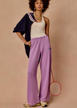THE UPSIDE women's violet organic cotton Soul Cal Wide Leg Track Pant is designed for a relaxed fit, featuring a mid rise waist and wide leg silhouette. Made for lifestyle.