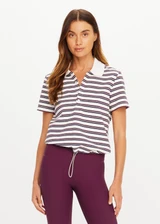 THE UPSIDE women's stripe organic cotton Sophie Cropped Polo Shirt is designed for a cropped fit and features a collared neckline, button front closure and adjustable drawcord hem detailing. Made for lifestyle.