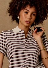 THE UPSIDE women's stripe organic cotton Sophie Cropped Polo Shirt is designed for a cropped fit and features a collared neckline, button front closure and adjustable drawcord hem detailing. Made for lifestyle.
