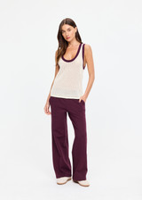 THE UPSIDE women's cream organic cotton Fenway Wales Knit Tank is designed for a relaxed fit and features a basketball-inspired tank silhouette, open knit construction and contrast rib detailing. Made for lifestyle.