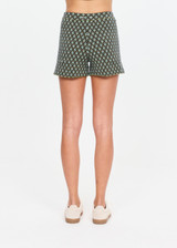 THE UPSIDE women's cream organic cotton blend Viva Jaya Knit Short features a mid rise fit and jacquard geo detailing with an embroidered arrow logo. Made for lifestyle.