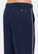 THE UPSIDE women's navy Lago Elita Pant is designed for a true-to-size mid rise fit and features a wide leg silhouette, side pockets and an adjustable drawcord waist. Made for lifestyle.