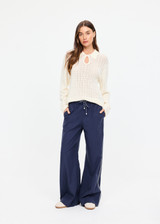 THE UPSIDE women's navy Lago Elita Pant is designed for a true-to-size mid rise fit and features a wide leg silhouette, side pockets and an adjustable drawcord waist. Made for lifestyle.