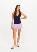 THE UPSIDE women's navy organic cotton Abby V Neck Tank Top features a low V neckline, ribbed construction and a high back design. Made for lifestyle.