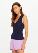 THE UPSIDE women's navy organic cotton Abby V Neck Tank Top features a low V neckline, ribbed construction and a high back design. Made for lifestyle.