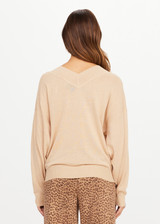 THE UPSIDE women’s sand linen organic cotton Bonita V Neck Knit is designed for a regular fit and features a wide neckline, dropped shoulders and ribbed trims. Made for lifestyle.