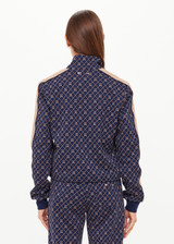 THE UPSIDE women's monogram jacquard Ezra Morgan Quarter Zip features elasticated cuffs, drawcord hem, and front pockets. Made for lifestyle.